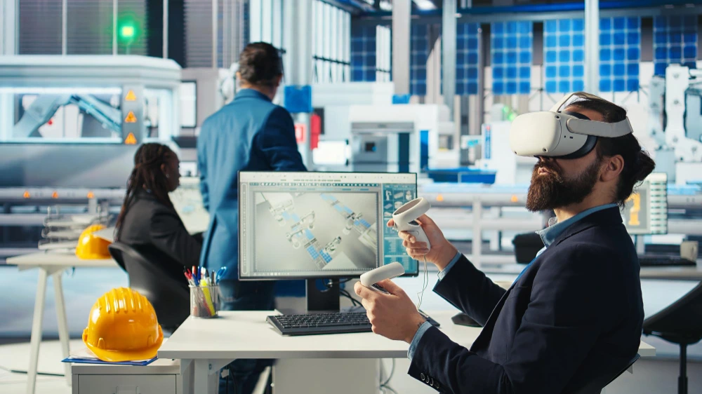 Construction engineer using VR headset for 3D building estimation and project planning in modern manufacturing facility with CAD blueprints on screen-Future of Construction Estimation