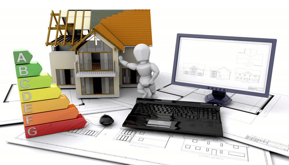 3D house model under construction with energy efficiency rating scale A-G, laptop displaying architectural CAD software, and building blueprints for sustainable home design
