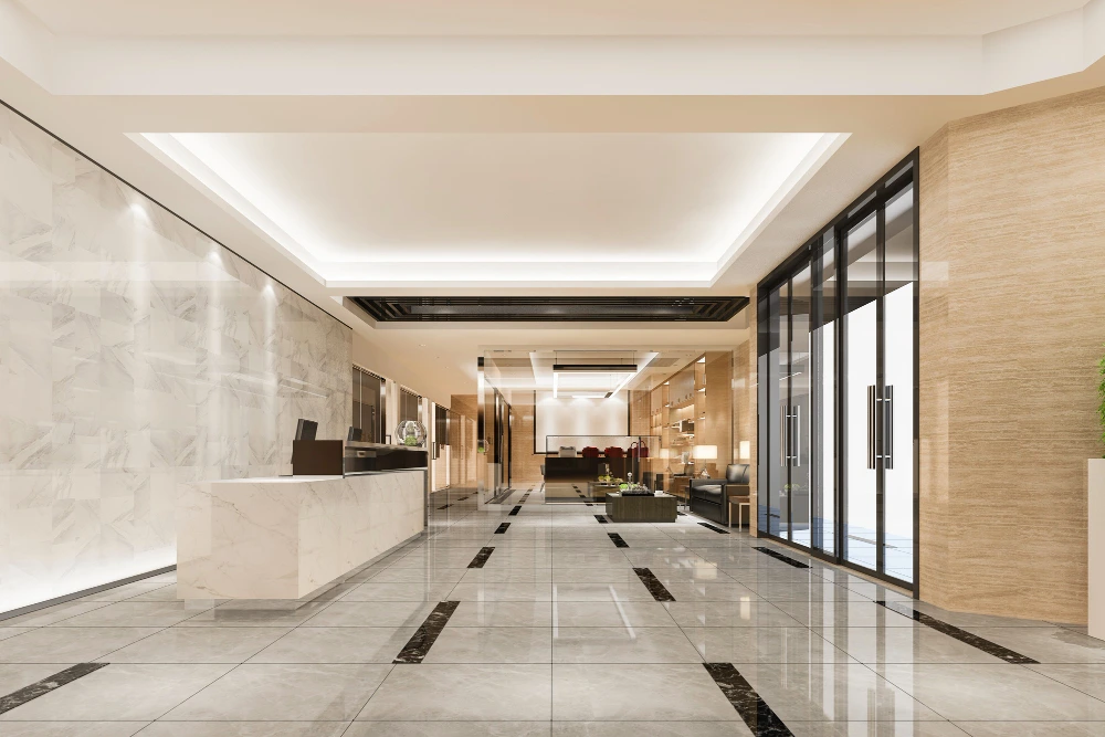 Elegant modern lobby with polished marble floors, geometric black accent strips, marble reception desk, floor-to-ceiling windows, wood paneling, and contemporary seating area with recessed ceiling lighting -  Retail Fit-Out Experts