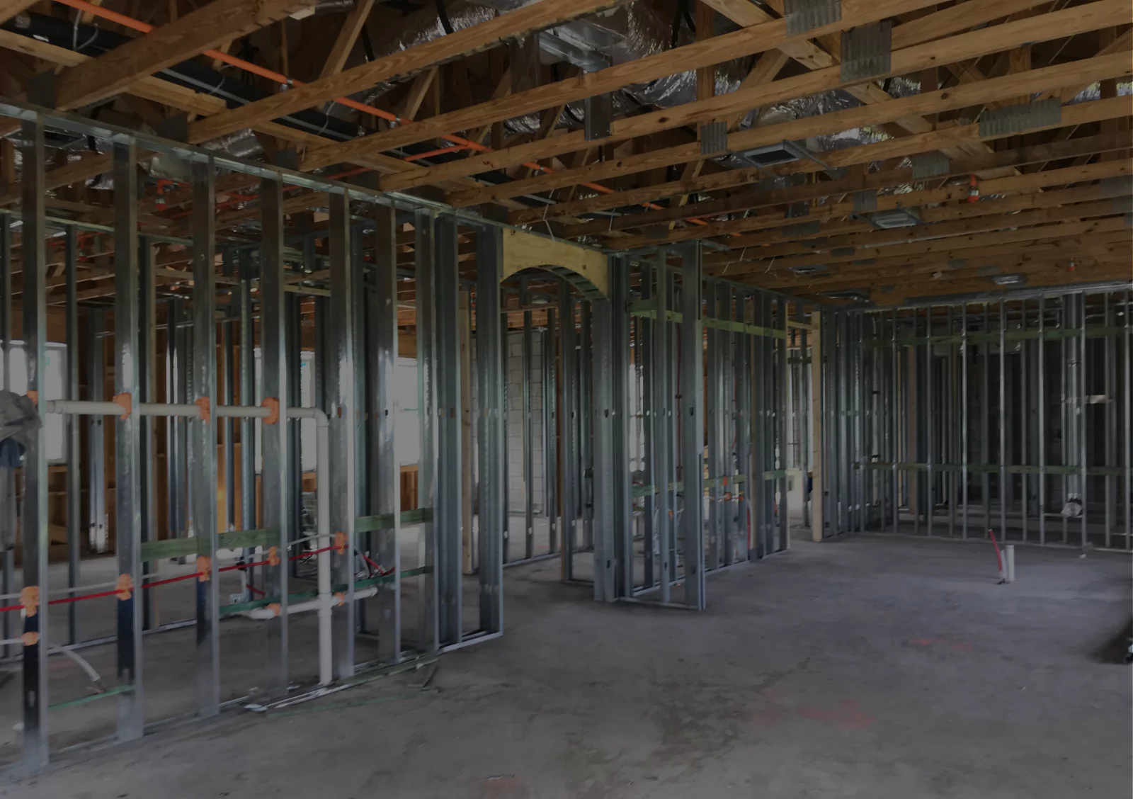Commercial building interior framing with steel studs and ceiling joists for construction takeoff and material estimating