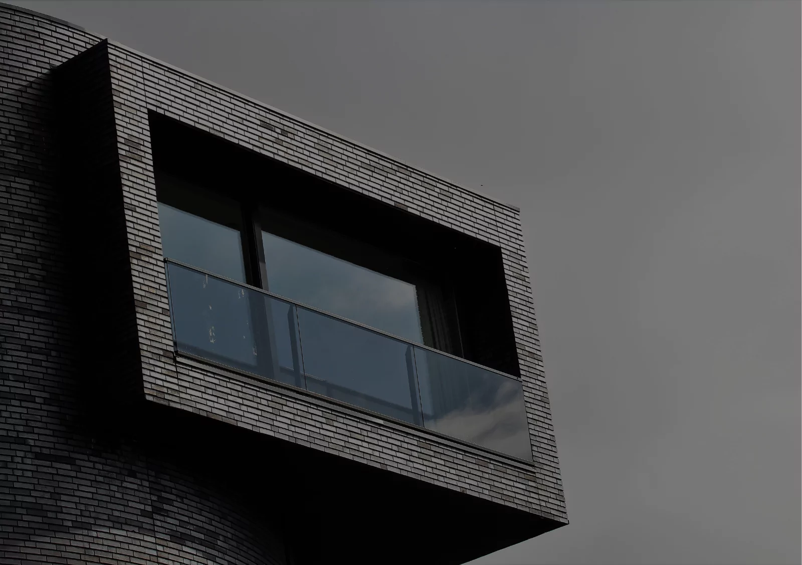 Modern commercial building exterior with brick facade showcasing professional construction and architectural design work